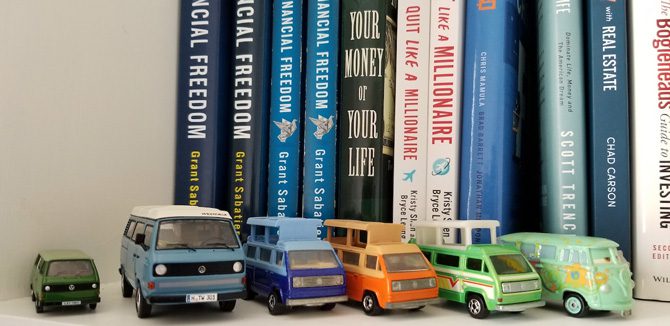 Financial Freedom books and mini VWs sitting on shelf